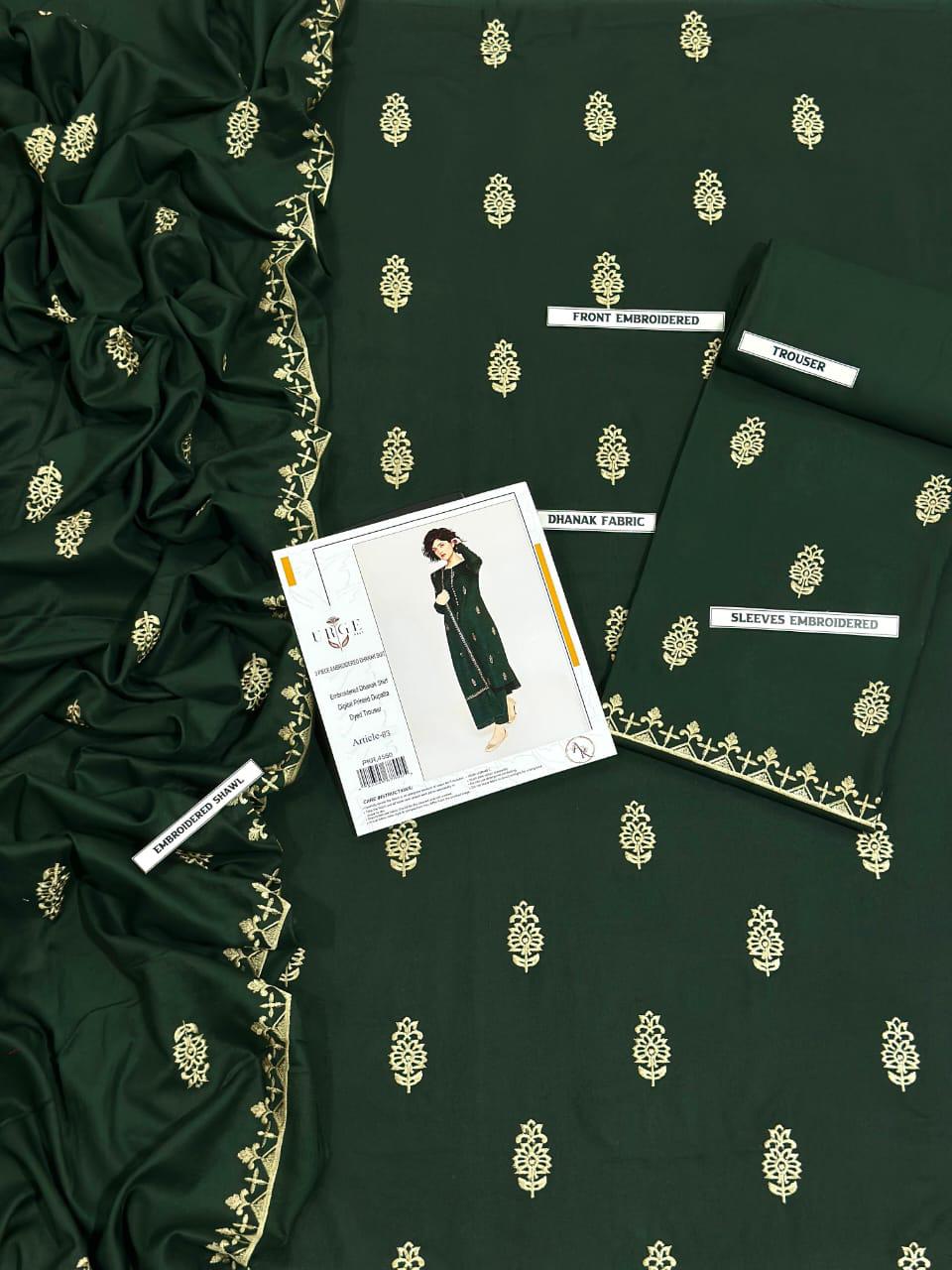 Dark green fabric with gold patterns and a sewing pattern book on top