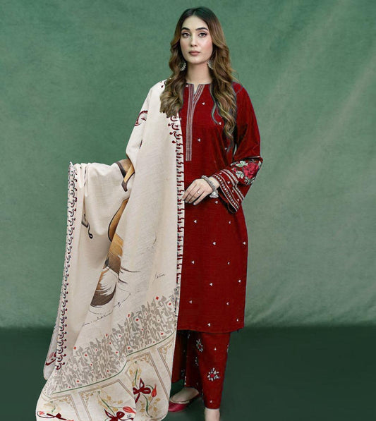 Woman holding a large embroidered scarf against a green background