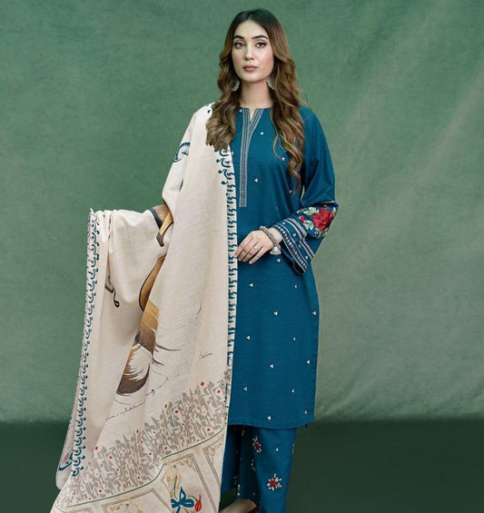 Woman holding a large embroidered scarf against a green background