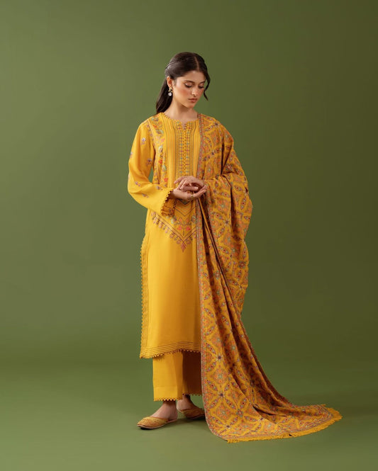 Woman wearing a yellow traditional outfit with a green background